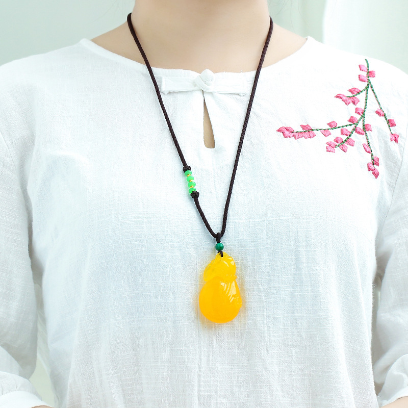จี้แกะสลักรูปถุงเงินจากอำพันแล - Circle Round Bag บทวิจารณ์และราคา